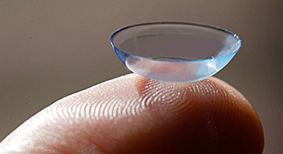 Contact lens on finger